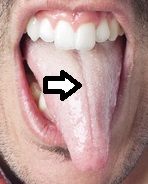 Young man sticking out his tongue